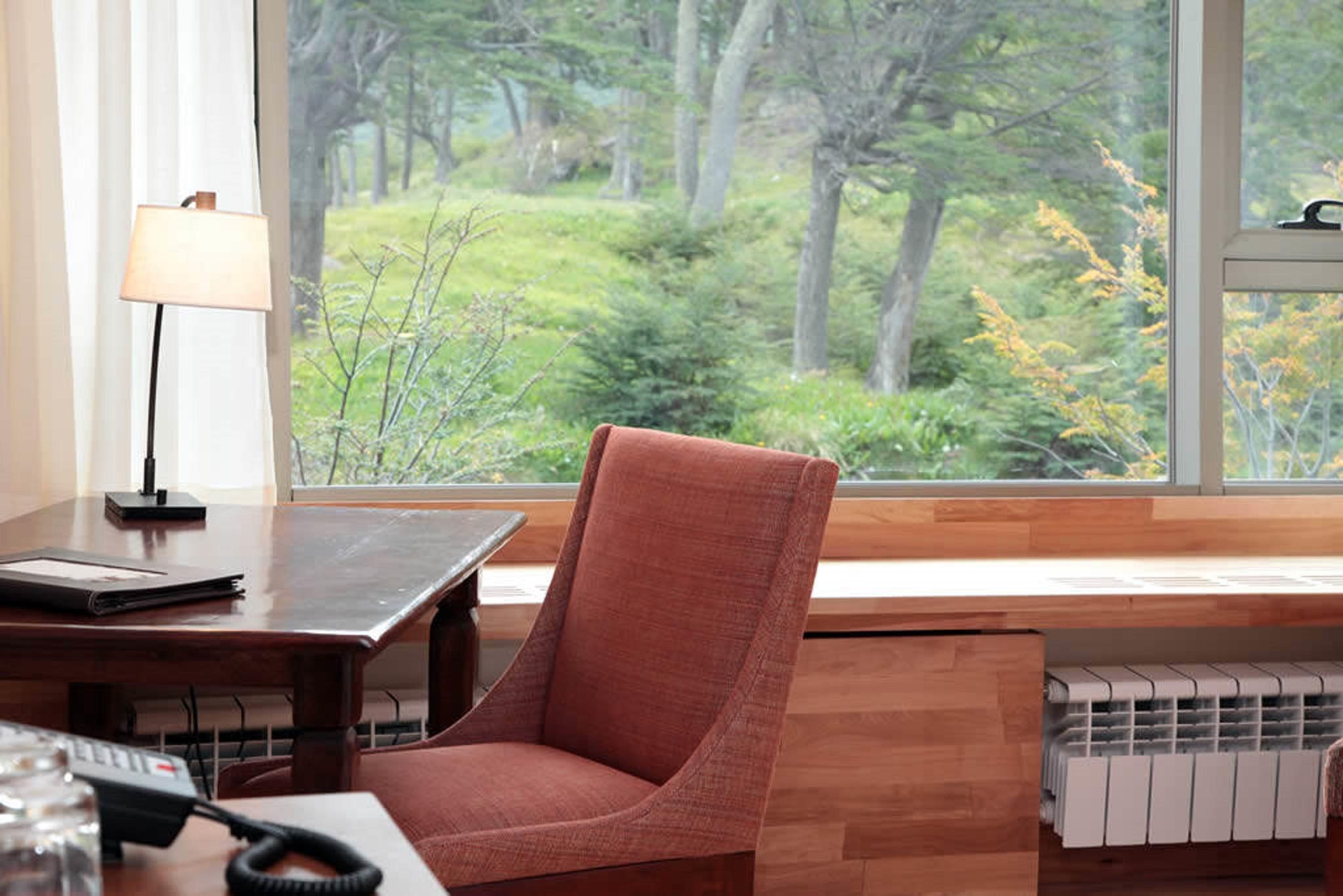 Arakur Ushuaia Resort & Spa Exterior foto A view of the woods from the library